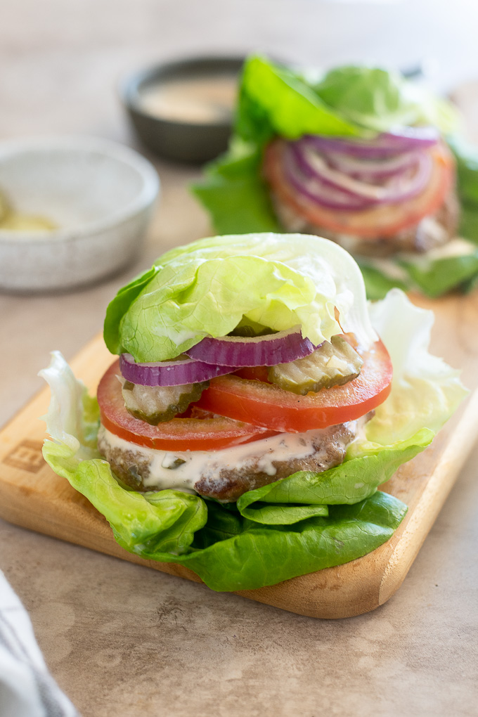 Grilled turkey burgers wrapped in lettuce wraps