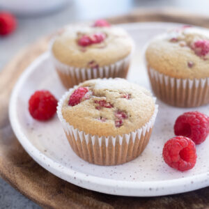 Healthy raspberry muffins on a white plate