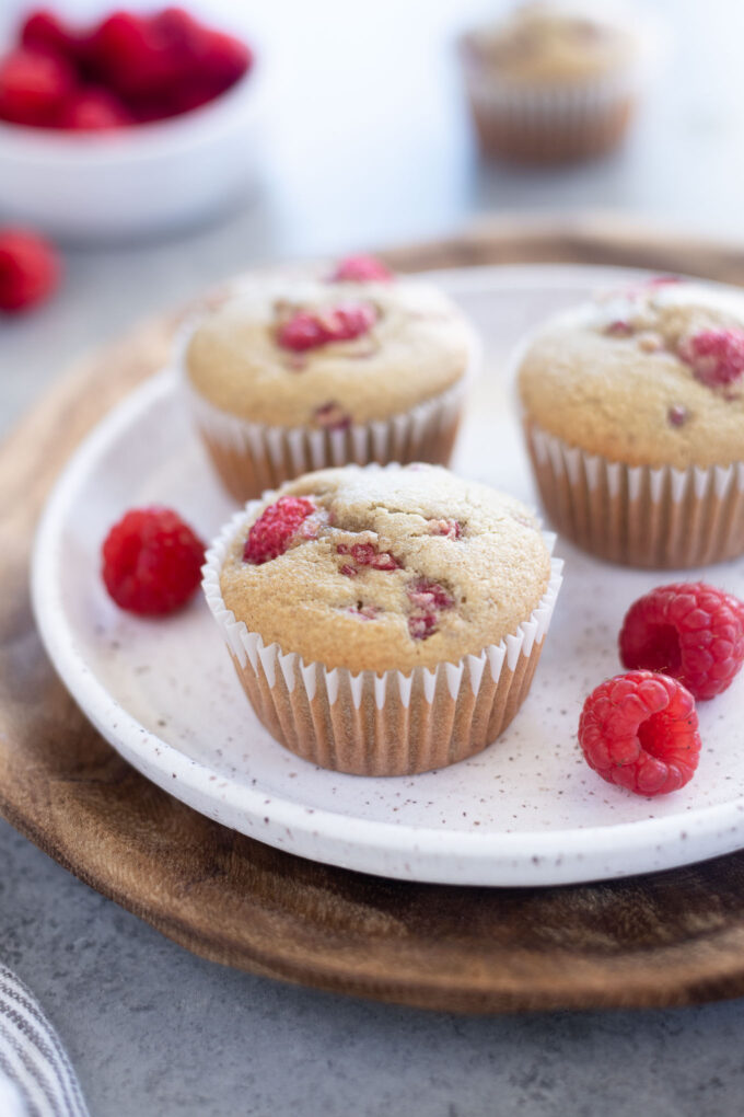 Healthy raspberry muffins on a white plate