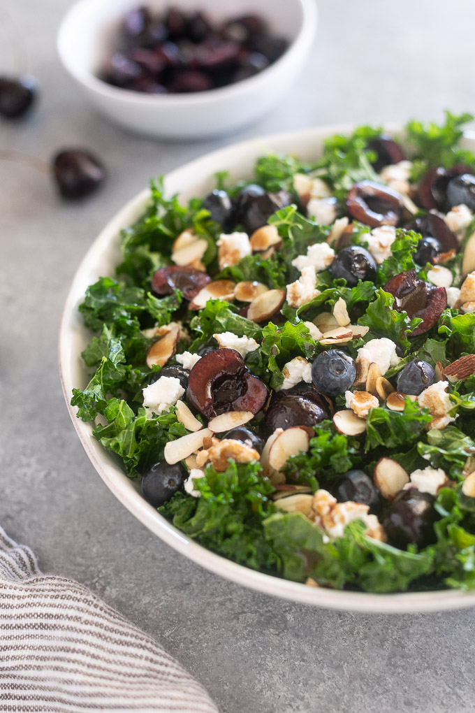 Kale cherry salad in a white bowl