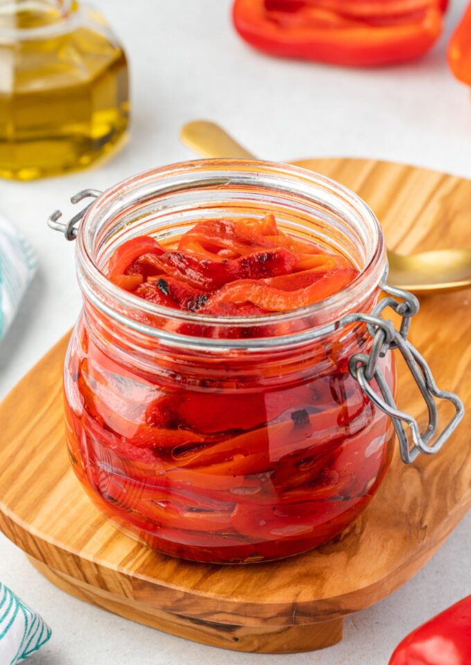 Roasted red peppers in a jar with olive oil