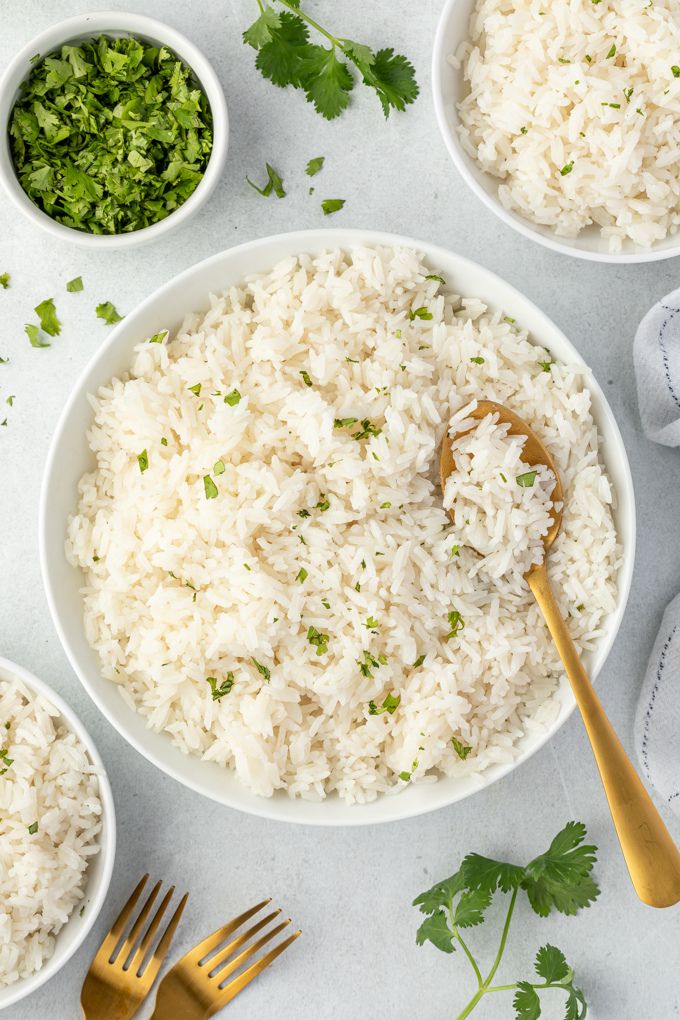 Coconut milk rice in a bowl with a serving spoon