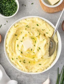 Yukon gold mashed potatoes in a bowl with serving spoon