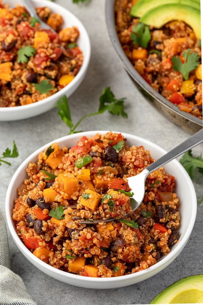 Bowl of Mexican quinoa with fork digging in