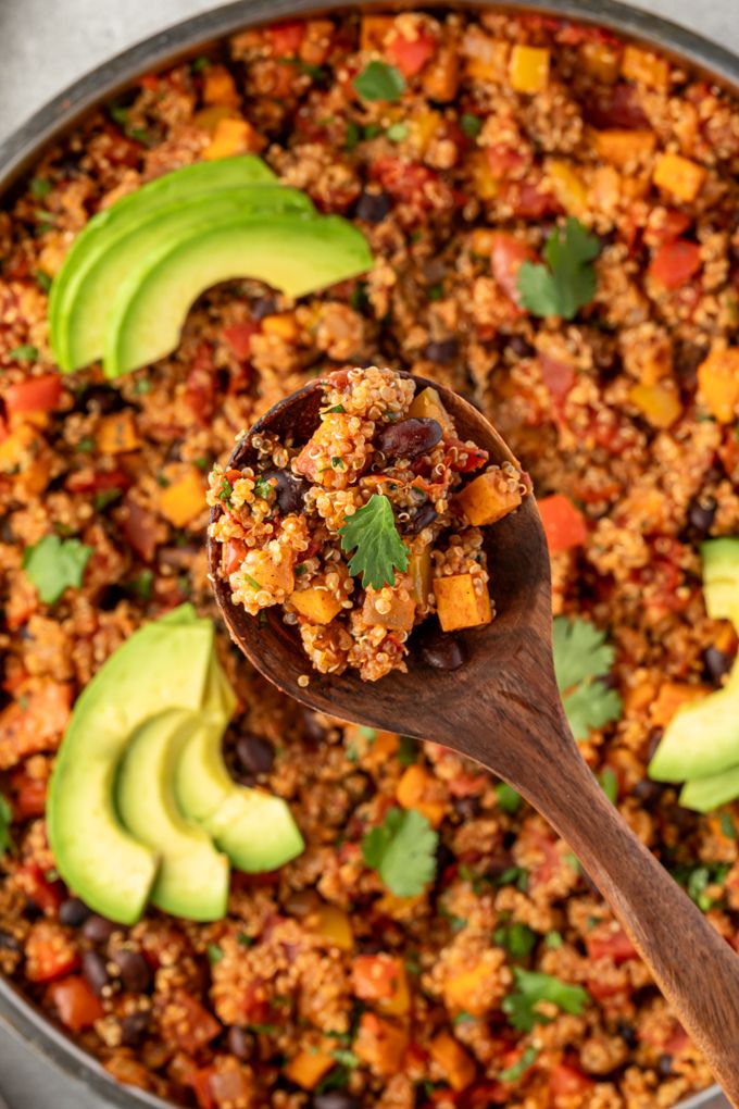 Spoonful of Mexican quinoa over the pan