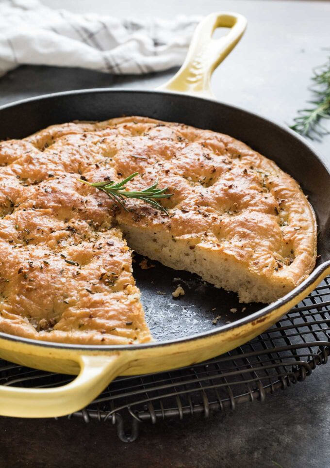 One hour focaccia bread in skillet with missing slice