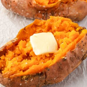 Baked sweet potato with pat of butter