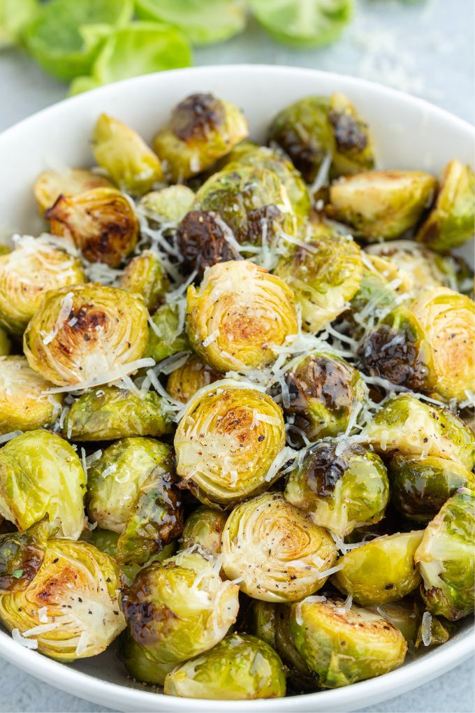 Air fryer brussels sprouts in a bowl with parmesan cheese