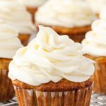 Cream cheese frosting piped on a cupcake
