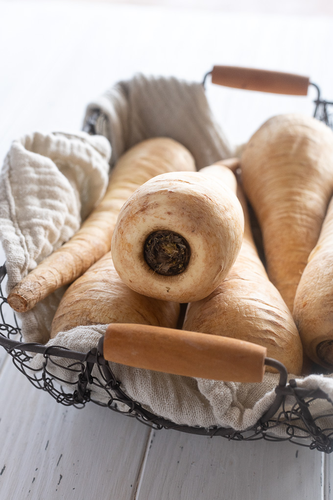 Parsnips in a wire basket lined with a linen