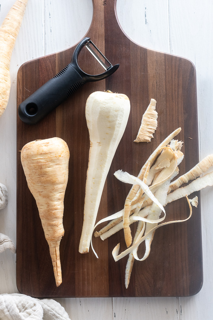 Peeled parsnips on a cutting board