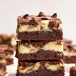Stack of cheesecake brownies.