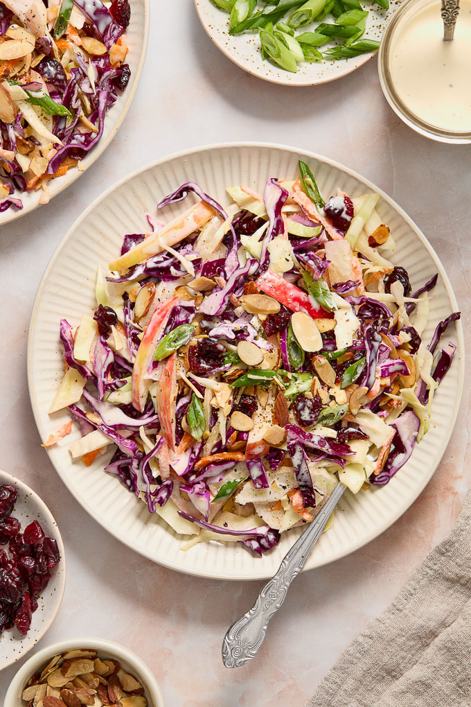 Fennel and apple slaw on a plate with a fork