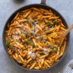 One pot roasted red pepper pasta in a skillet.