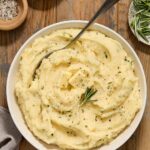 Crock pot mashed potatoes with buttermilk in a bowl.