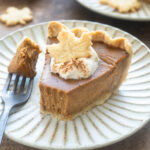 Spiced chai pumpkin pie on a plate.