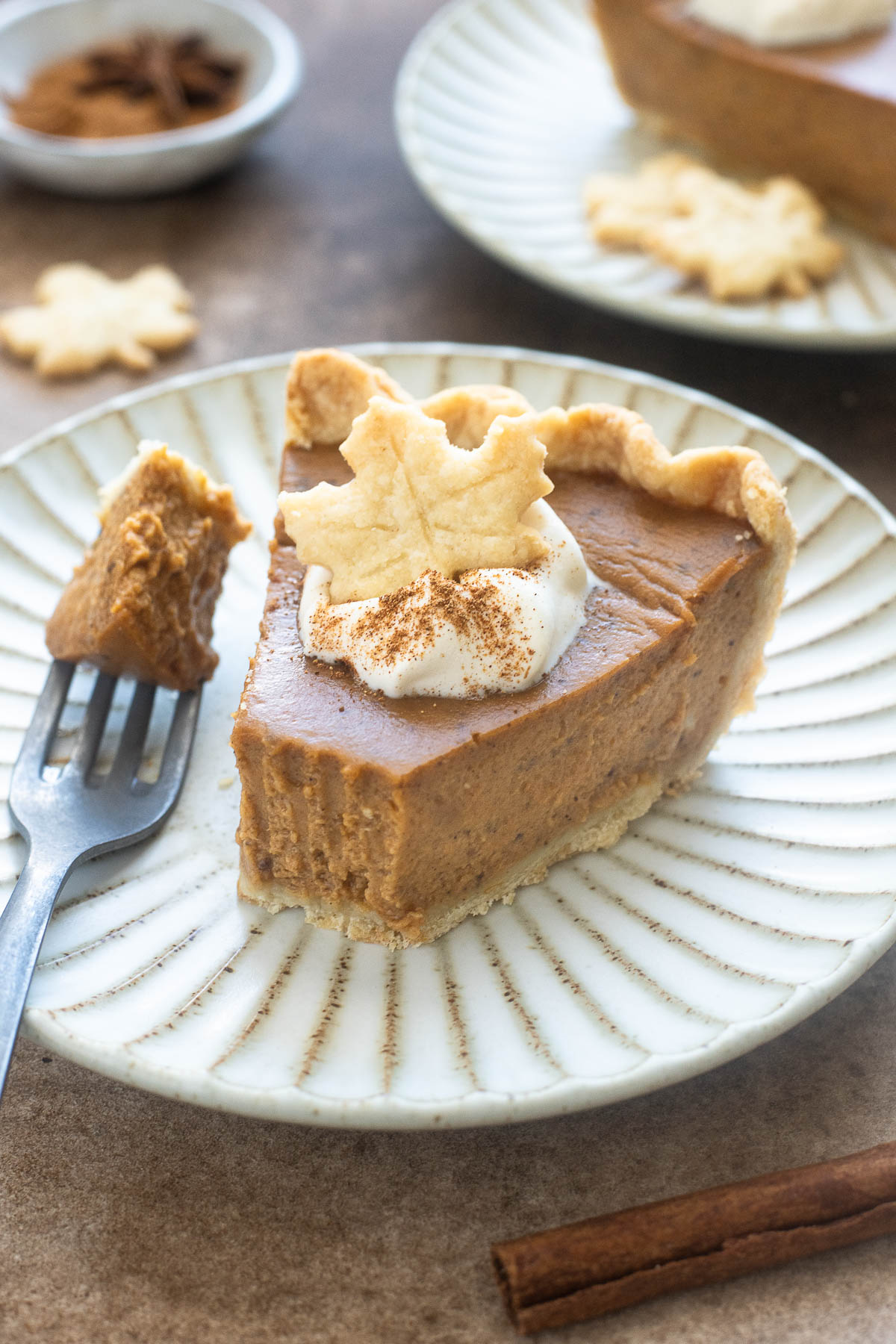 Spiced chai pumpkin pie on a plate.