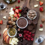 Chocolate charcuterie board with chocolate ganache, fruits and more.