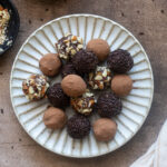 Salted caramel chocolate truffles on a plate.
