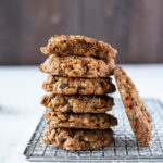 Carrot oatmeal cookies stacked with bite out of top cookie.
