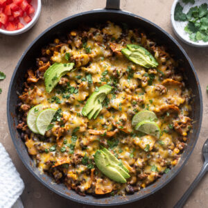 Ground beef enchilada casserole in skillet.