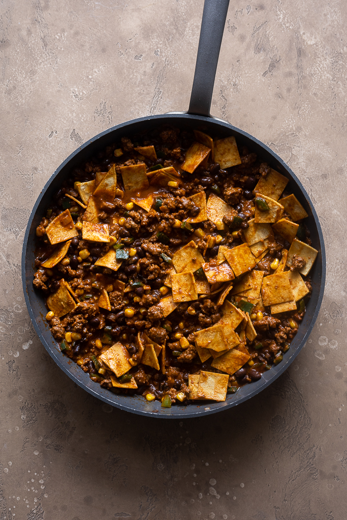 Ground beef with enchilada sauce and tortillas.
