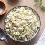 Dill pickle potato salad in a serving bowl.