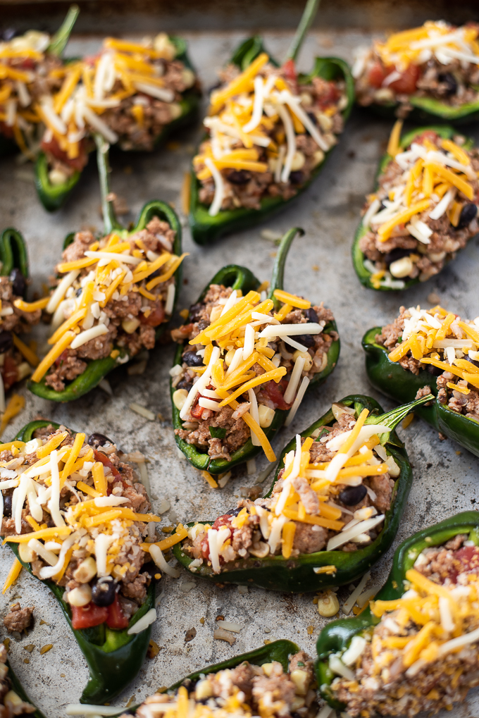 Assembled stuffed poblano peppers before baking.