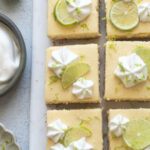 Key lime cheesecake bars cut into squares.