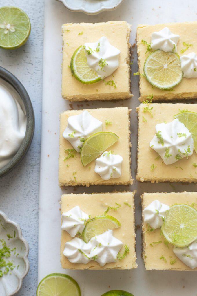 Key lime cheesecake bars cut into squares.