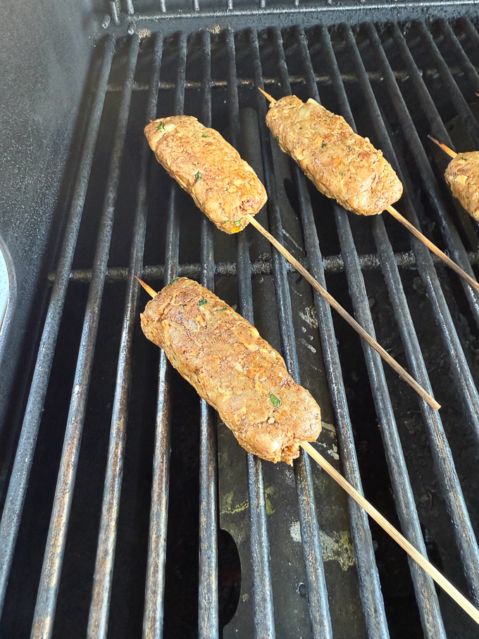 Lamb kofta kebabs on grill.