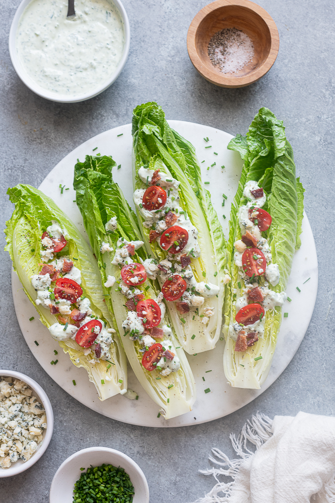 Assemble romaine wedge salads with goddess dressing.