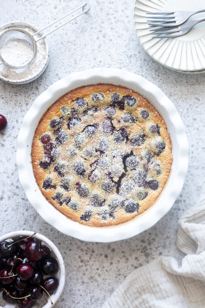 French cherry clafoutis with powdered sugar.