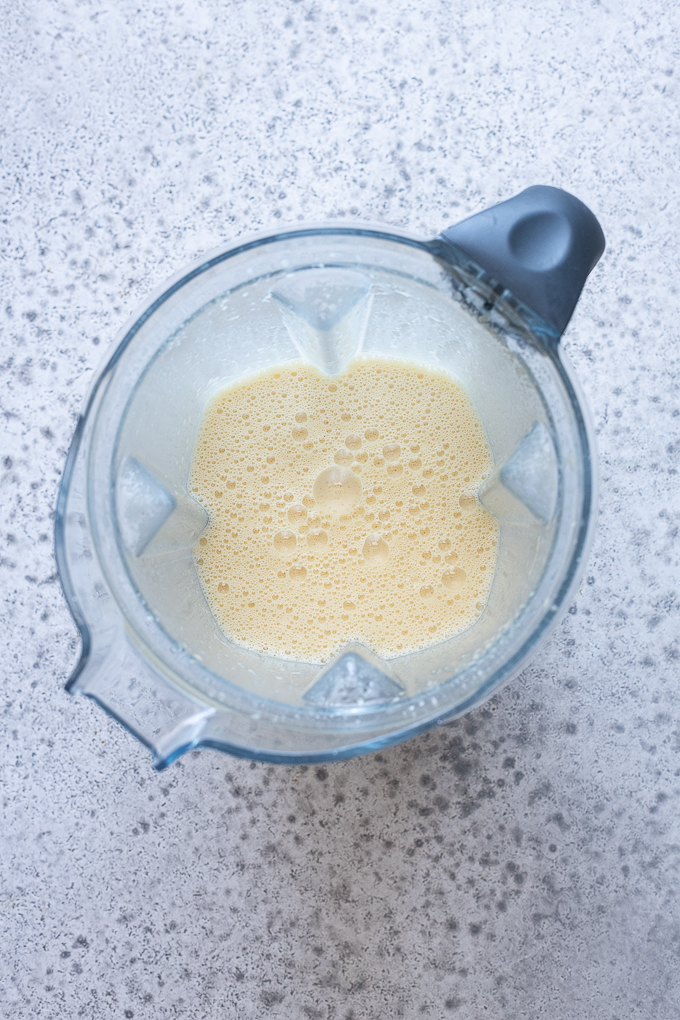 Cherry clafoutis batter combined in a blender.