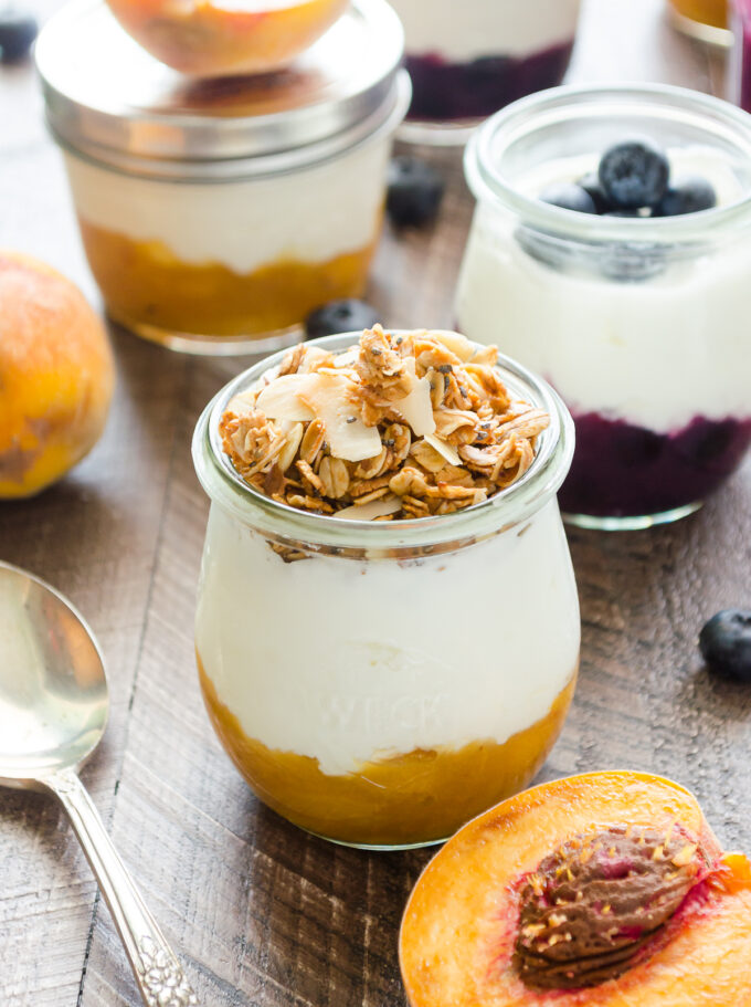 Fruit on the bottom yogurt cups with granola on top.