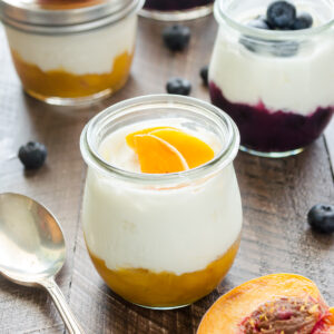 Homemade fruit on the bottom yogurt cups in jars.