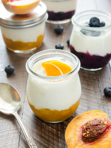 Homemade fruit on the bottom yogurt cups in jars.