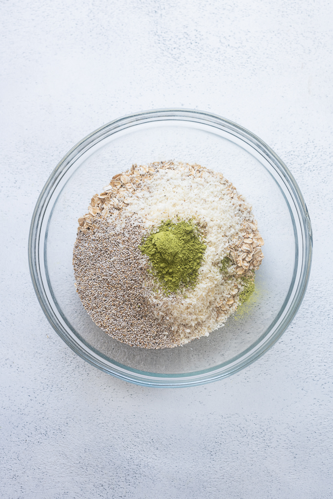 Matcha overnight oat recipe ingredients in a bowl.