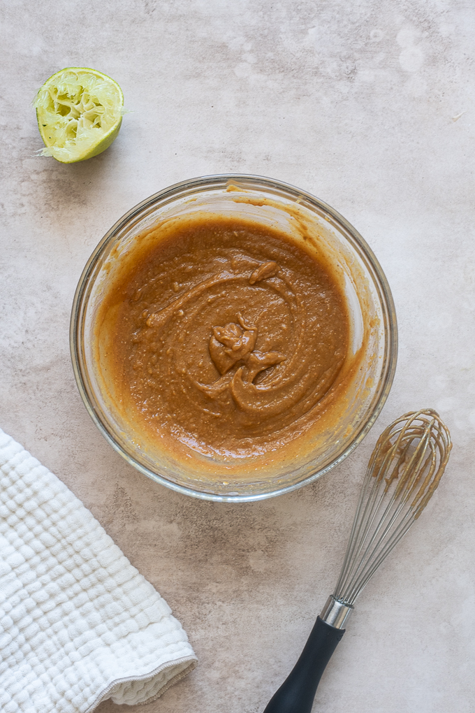 Peanut salad dressing combined in a mixing bowl.