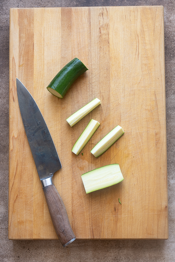 Zucchini cut into french fry shapes.