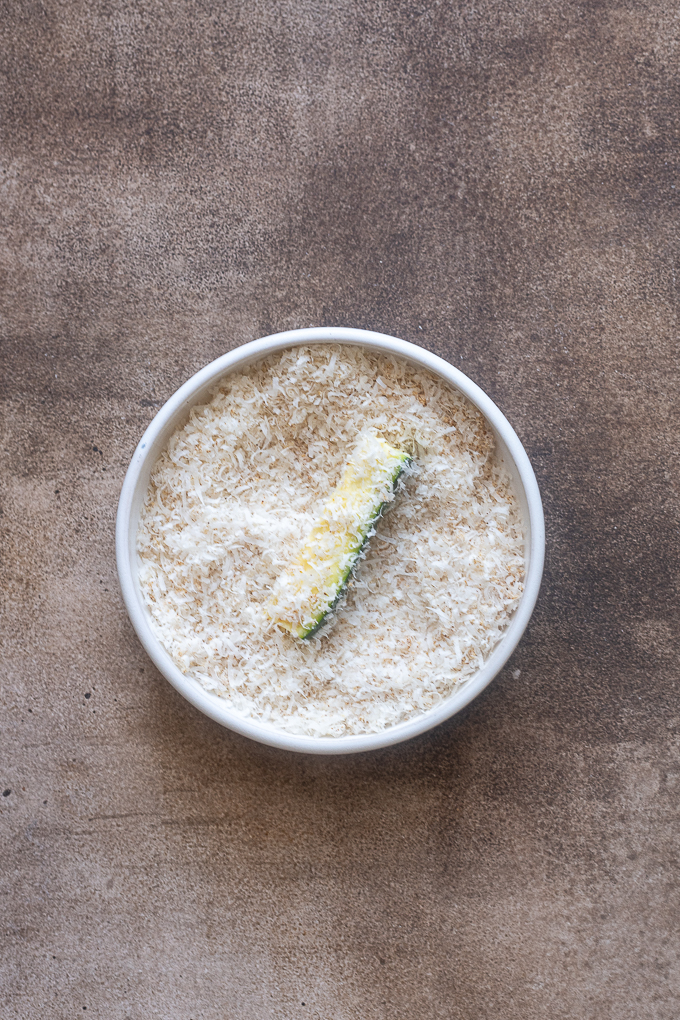 Zucchini fries dipped in parmesan cheese and seasoning.