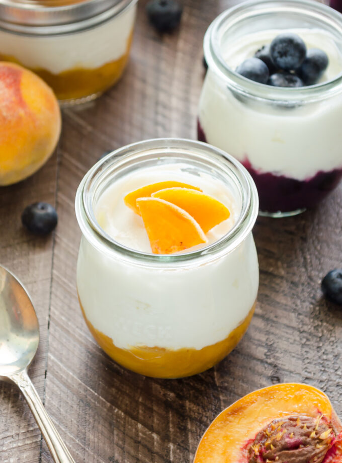 Yogurt cups with Greek yogurt and homemade peach and blueberry compotes.