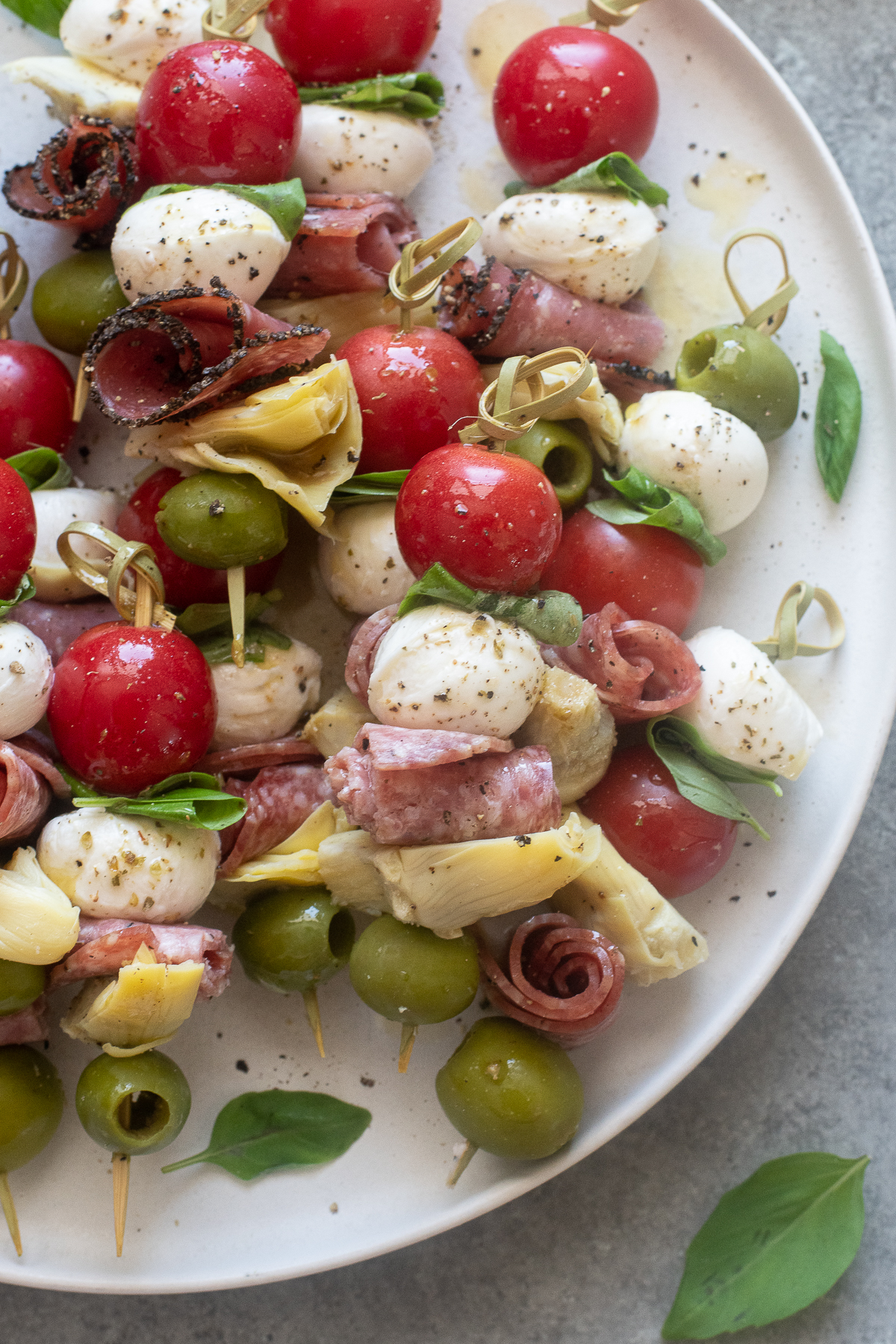 Antipasto skewers on a platter.