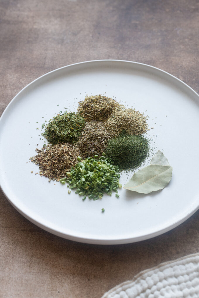 Common dried herbs for essential spice guide.