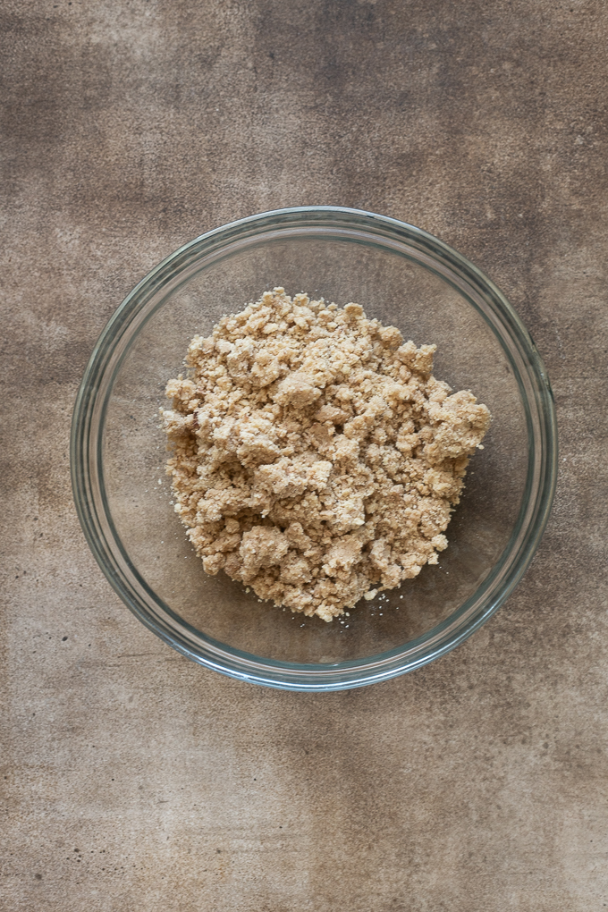Prepared shortbread crust and crumble for apple pie bars recipe.