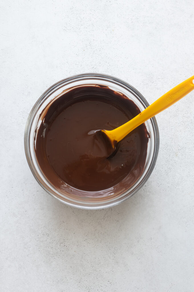 Melted dark chocolate chips and coconut oil in small bowl.