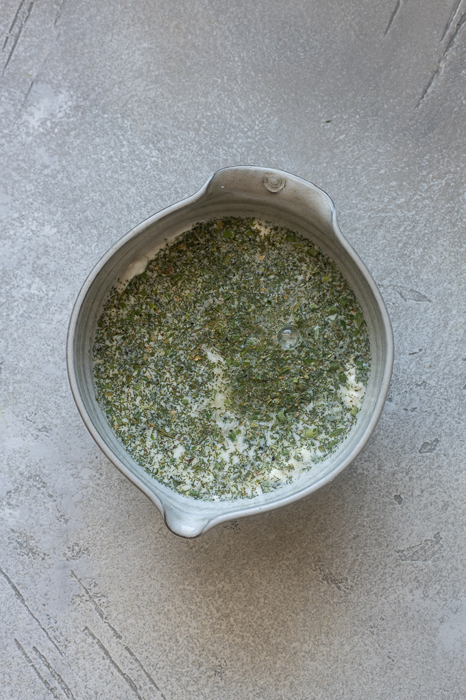 Ingredients for ranch dressing using Greek yogurt in a bowl.