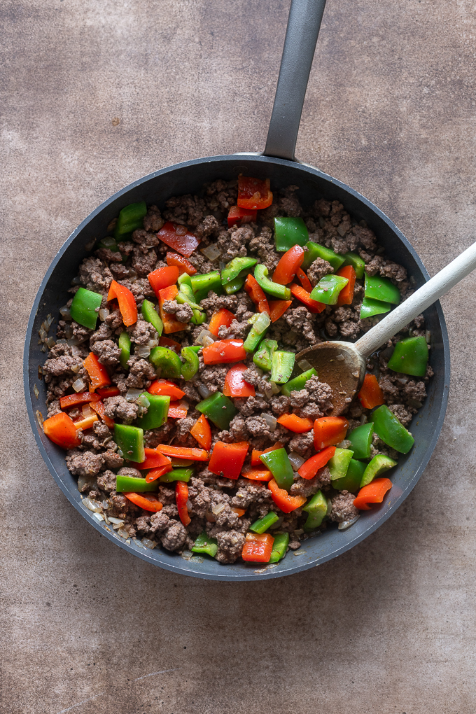 Cooked beef and bell peppers for stuffed pepper casserole.