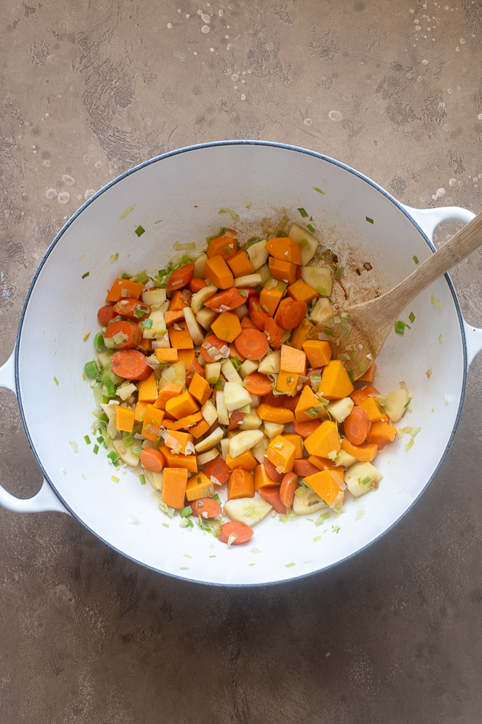 Leeks, carrots, parsnips and garlic sautéed for fall vegetable soup.
