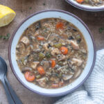 Chicken wild rice soup with no cream in a bowl.